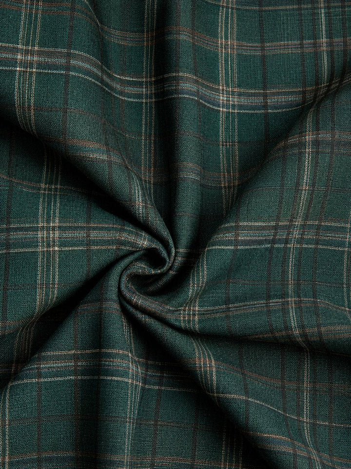 Close-up of green plaid flannel fabric texture on Emilia dress