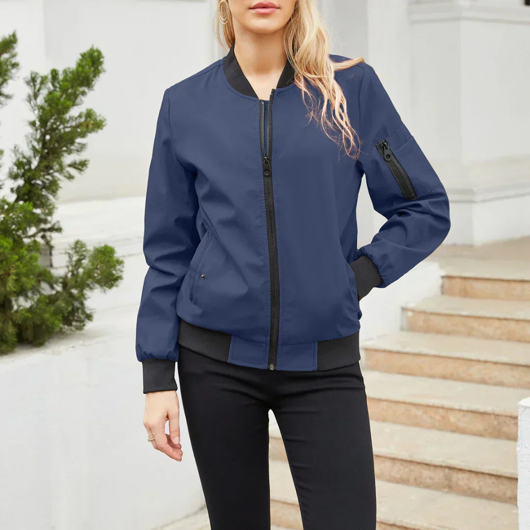 Freya navy blue bomber jacket with snap-button side pockets, front view