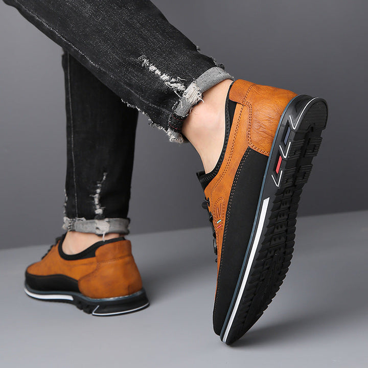 Edison men's casual shoe worn on foot with rolled denim jeans