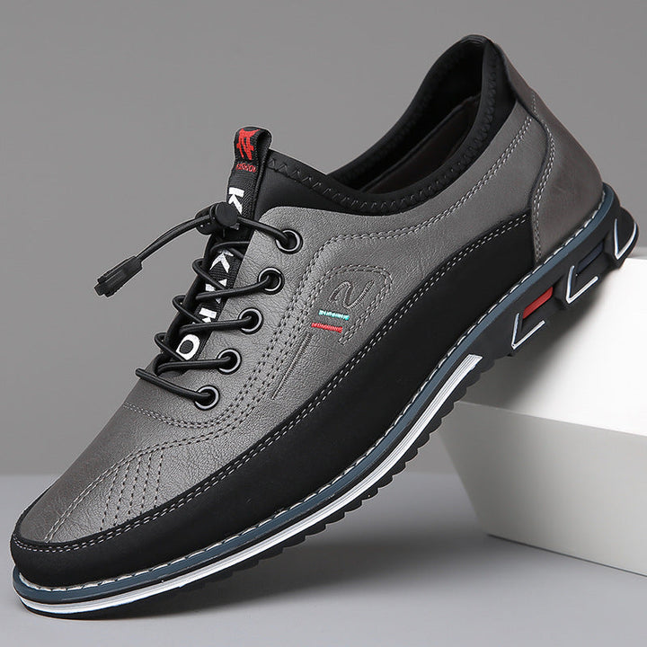 Edison men's casual shoe in grey with black sole, side view