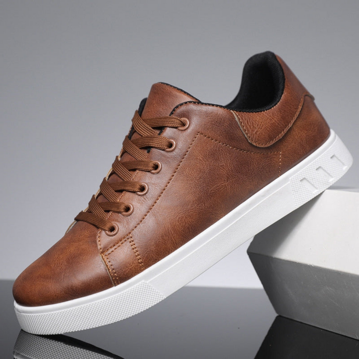 Theodore brown leather lace-up sneakers, side profile resting on box