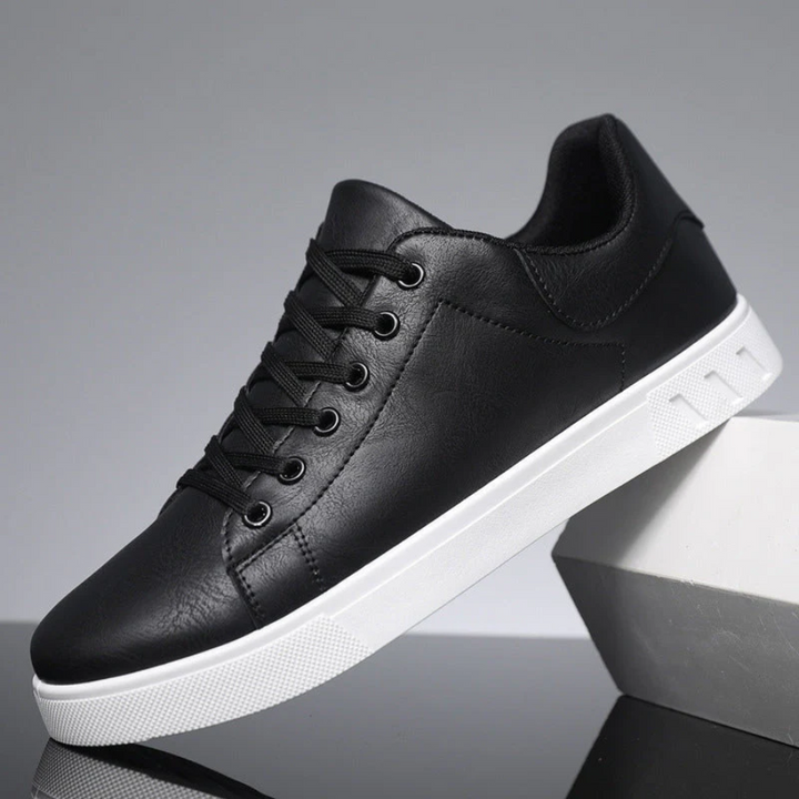 Theodore black leather lace-up sneakers, side profile resting on box