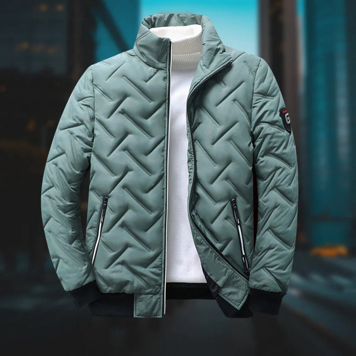 Barnaby green quilted bomber jacket, front view with white jumper