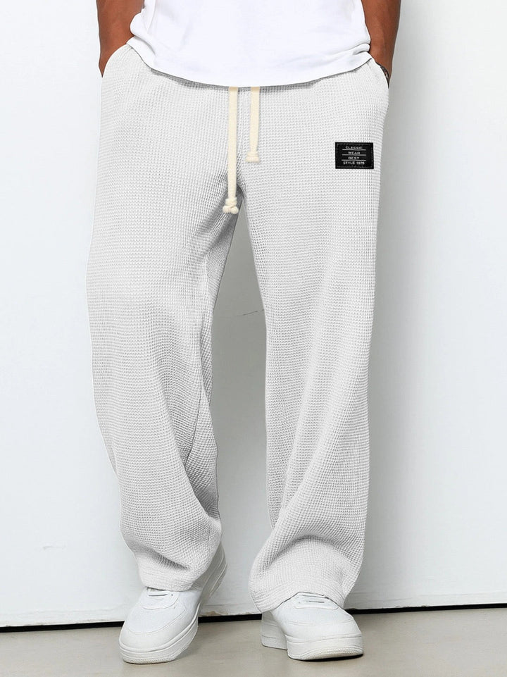 Huxley relaxed straight leg joggers in light grey, front view