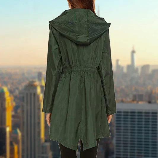 Poppy dark green rain jacket, back view on model