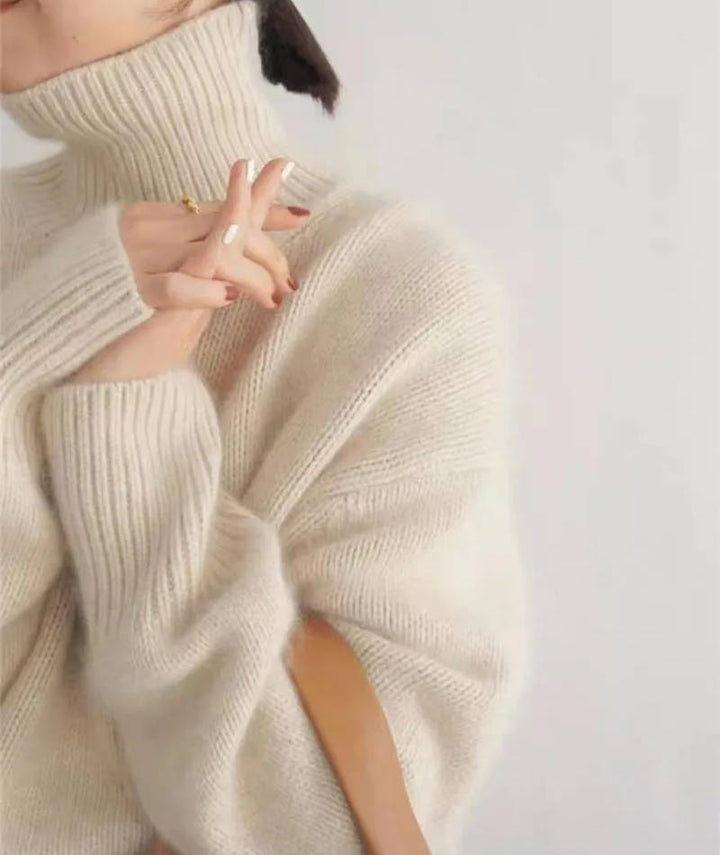 Marigold turtleneck jumper in cream, side view with tote bag