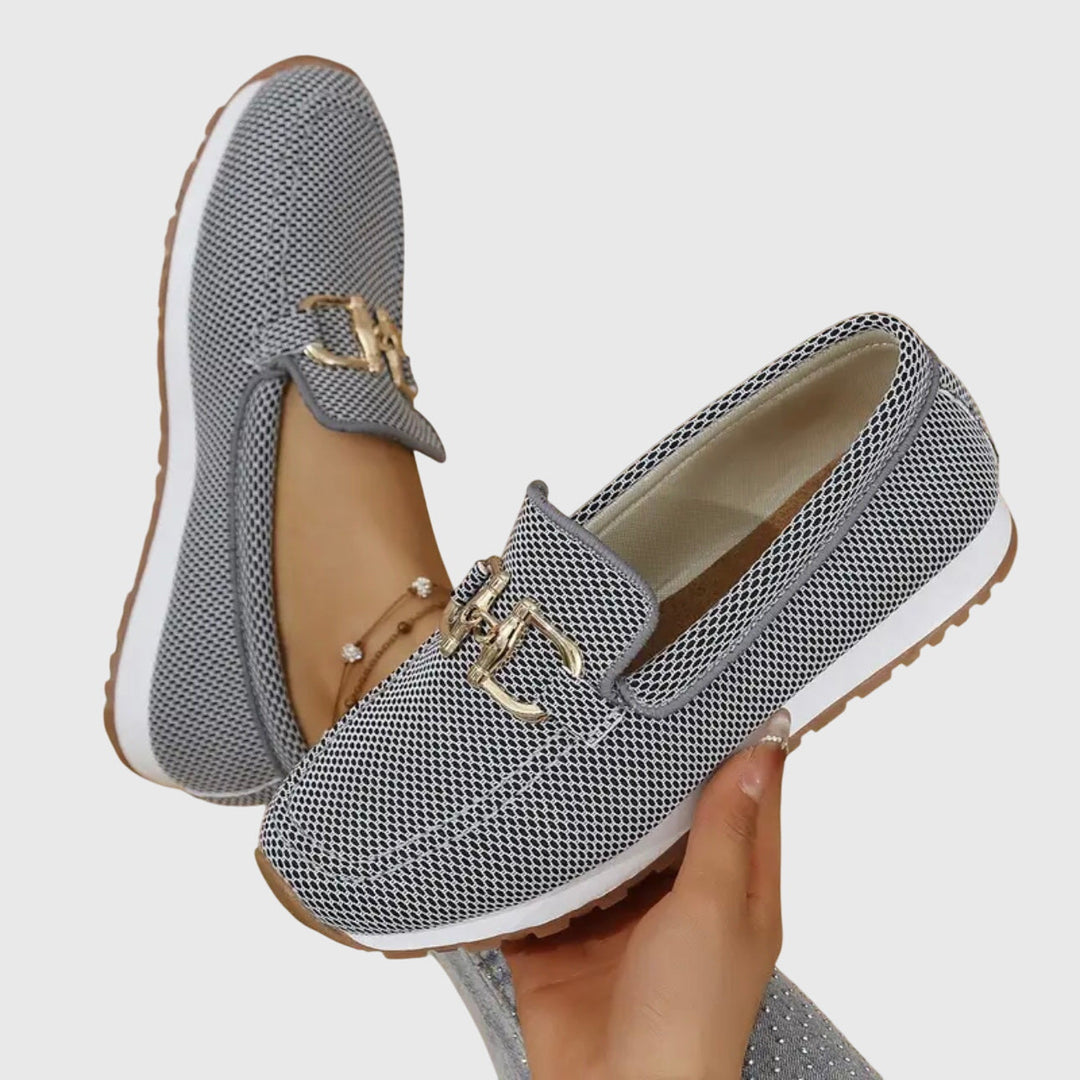 Beatrix slip-on loafer trainers in blue worn on feet, front view