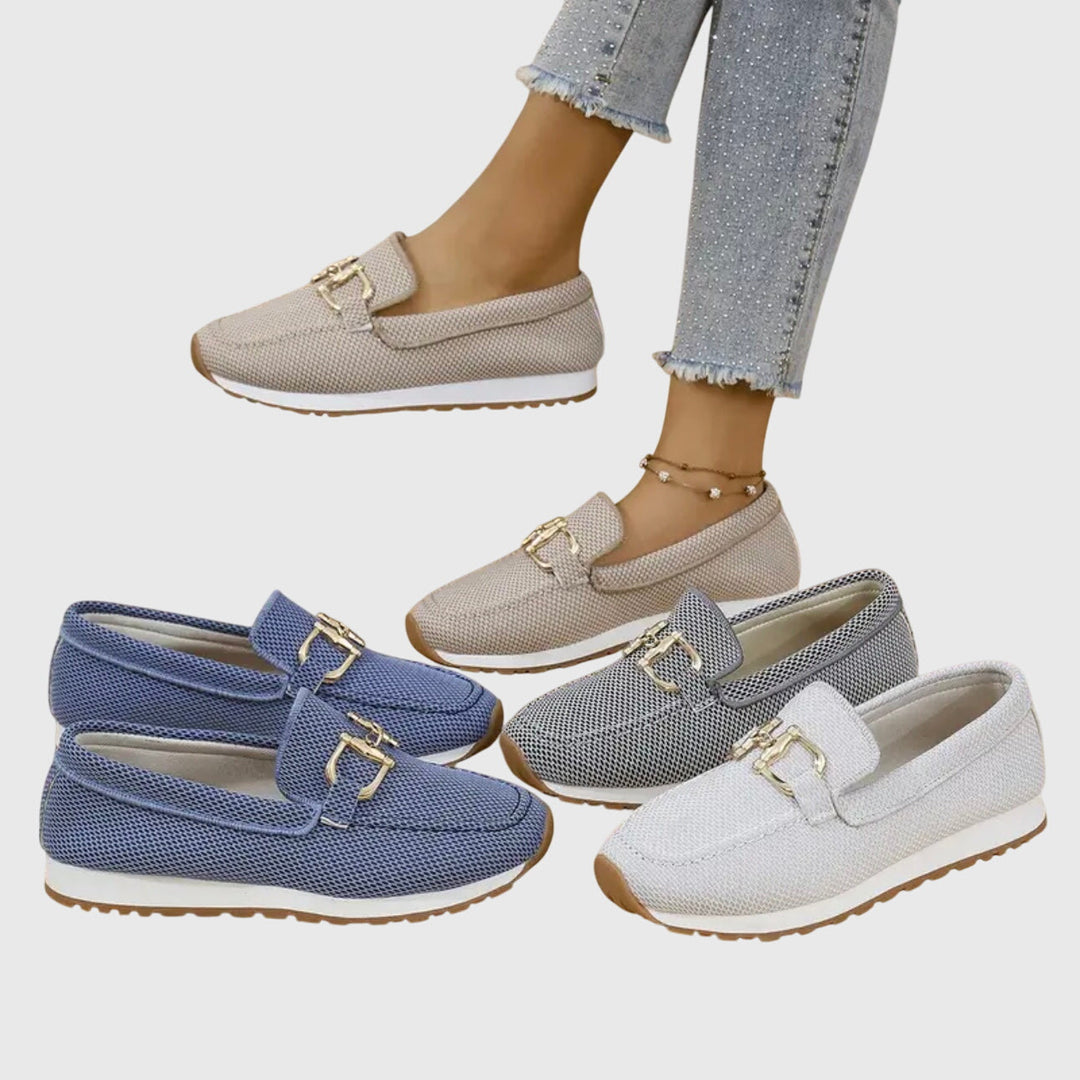 Beatrix slip-on loafer trainers in blue worn on feet, front view