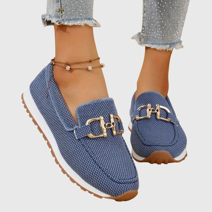Beatrix slip-on loafer trainers in blue worn on feet, front view