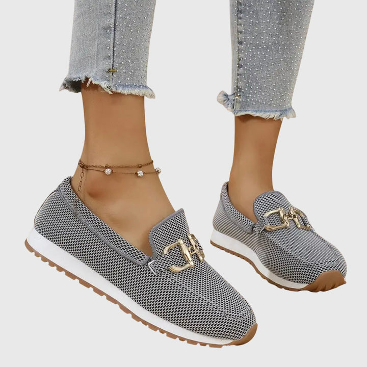 Beatrix slip-on loafer trainers in blue worn on feet, front view