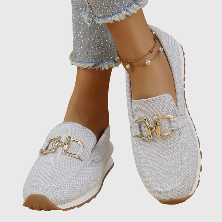 Beatrix slip-on loafer trainers in blue worn on feet, front view