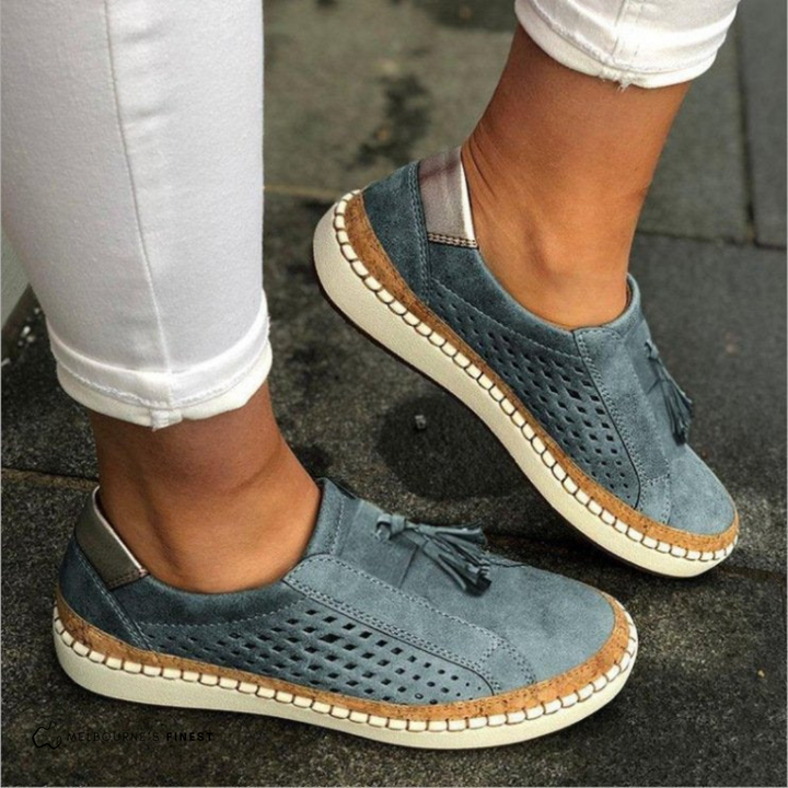 Matilda white perforated slip-on shoes, close side profile view
