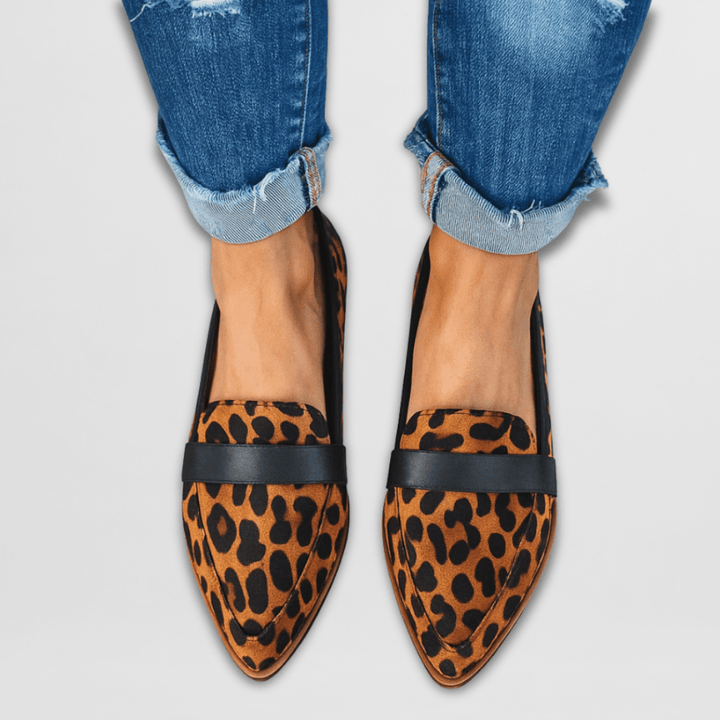 Rosalind suede penny loafers in leopard print, worn with cuffed jeans, front view